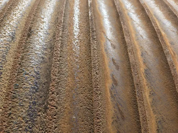 Close-up of severely corroded, pitted grooves on a Clyde barge crane boom hoist drum