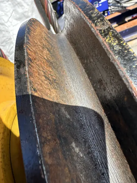 Negative rope impressions worn into a steel sheave groove on an overhead bridge crane