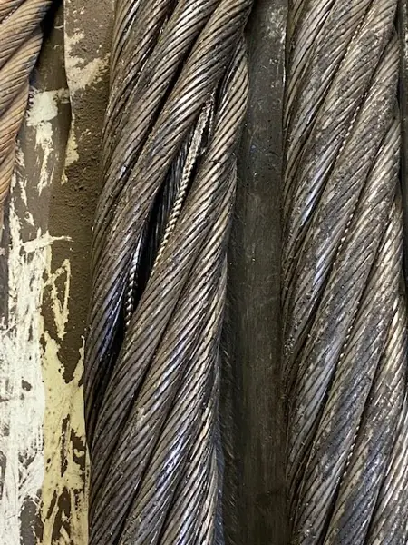 Close-up of a rope shovel hoist rope with opened strands from the wrong lay direction