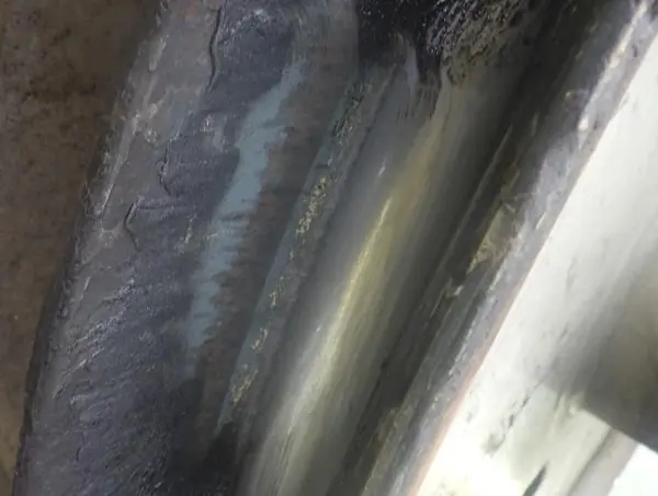 Worn flange on a trim beam deflection sheave of a Liebherr P125L ship-to-shore container crane