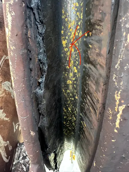 Hardened grease packed into a hoist sheave groove on a ZPMC ship-to-shore container crane